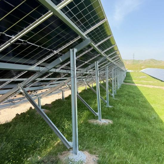 The photo demonstrates a row of solar panels mounted on a strong, ground-based system. This setup maximizes the efficiency of energy generation, providing a sustainable solution for homes or commercial properties with ample land space